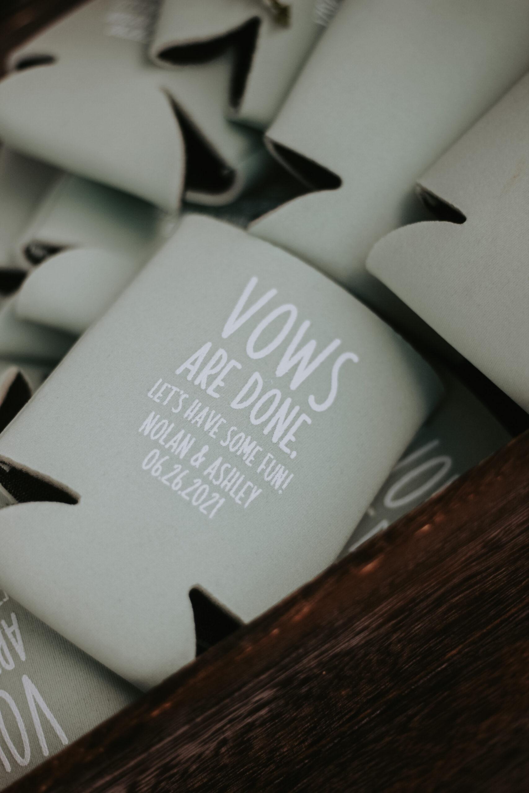 guest koozies for drinks in complementary light gray to match the light green wedding colors