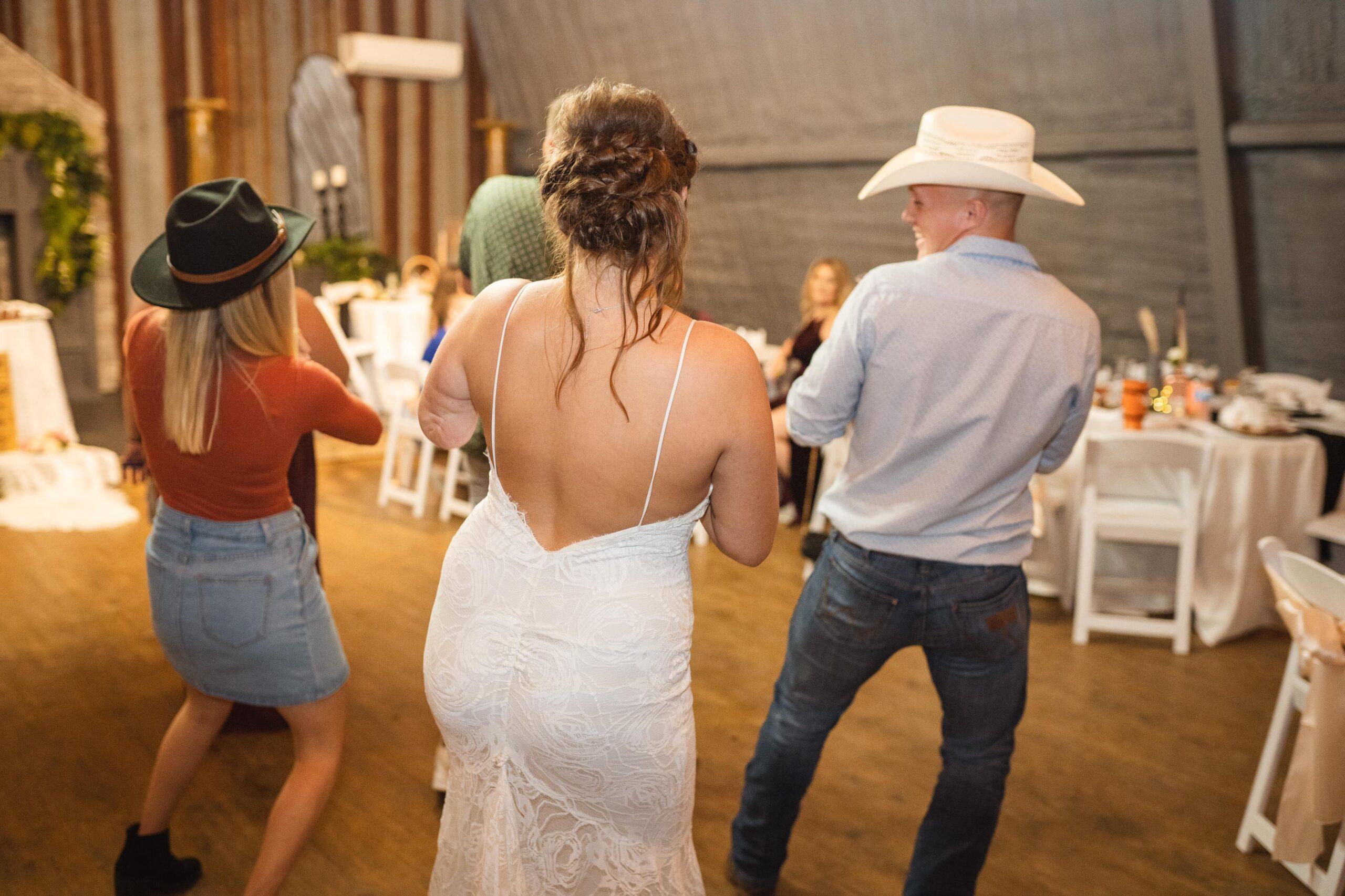 Photo of Bride and friends on dance floor