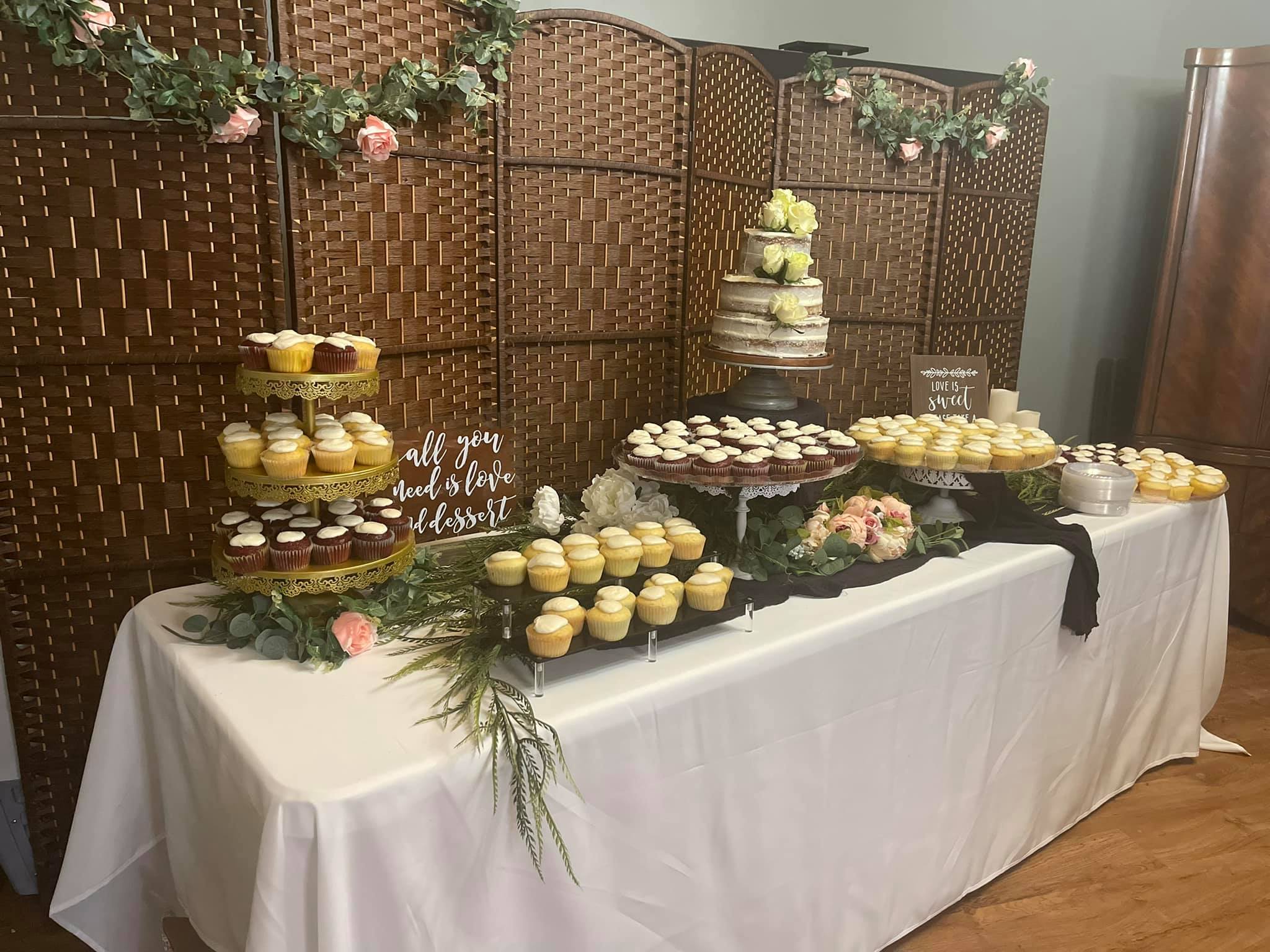 Photo of wedding cupcake and cake station