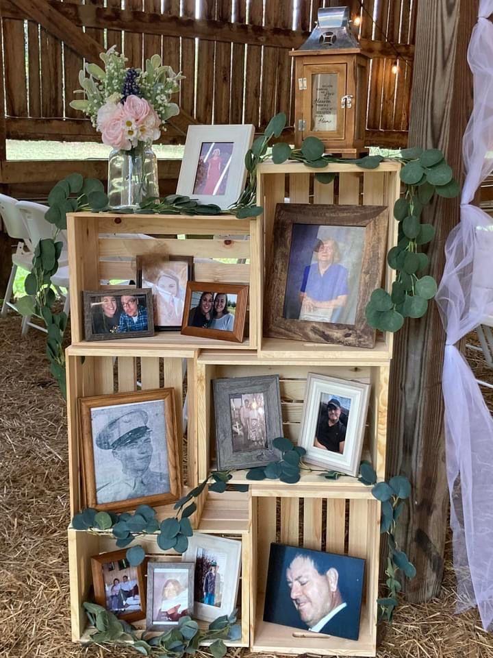 Family photos from the couple's extended family were placed in rustic crates as a display including famiy who are deceased