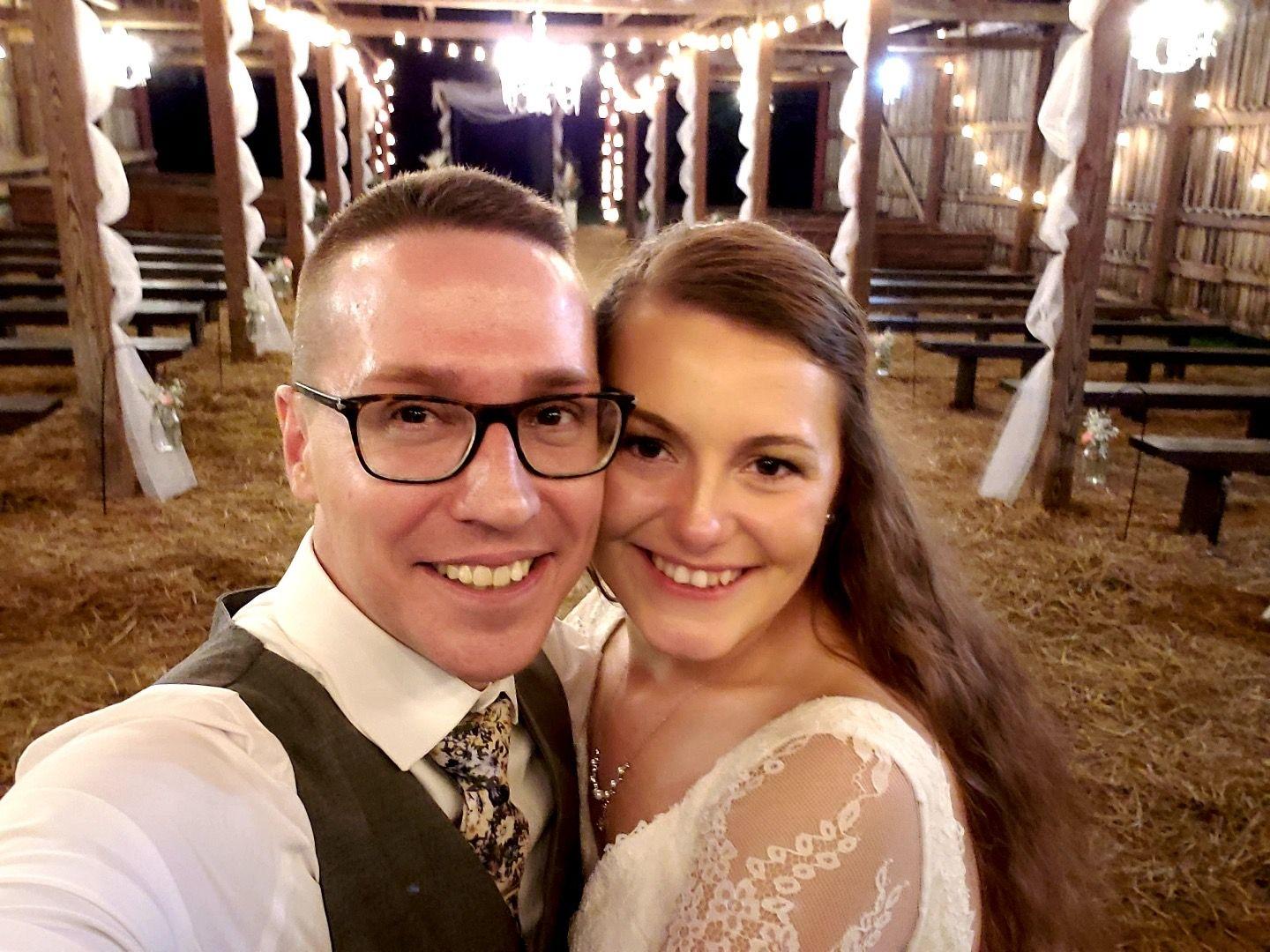 Jodi and Dustin Collins in the barn following the wedding