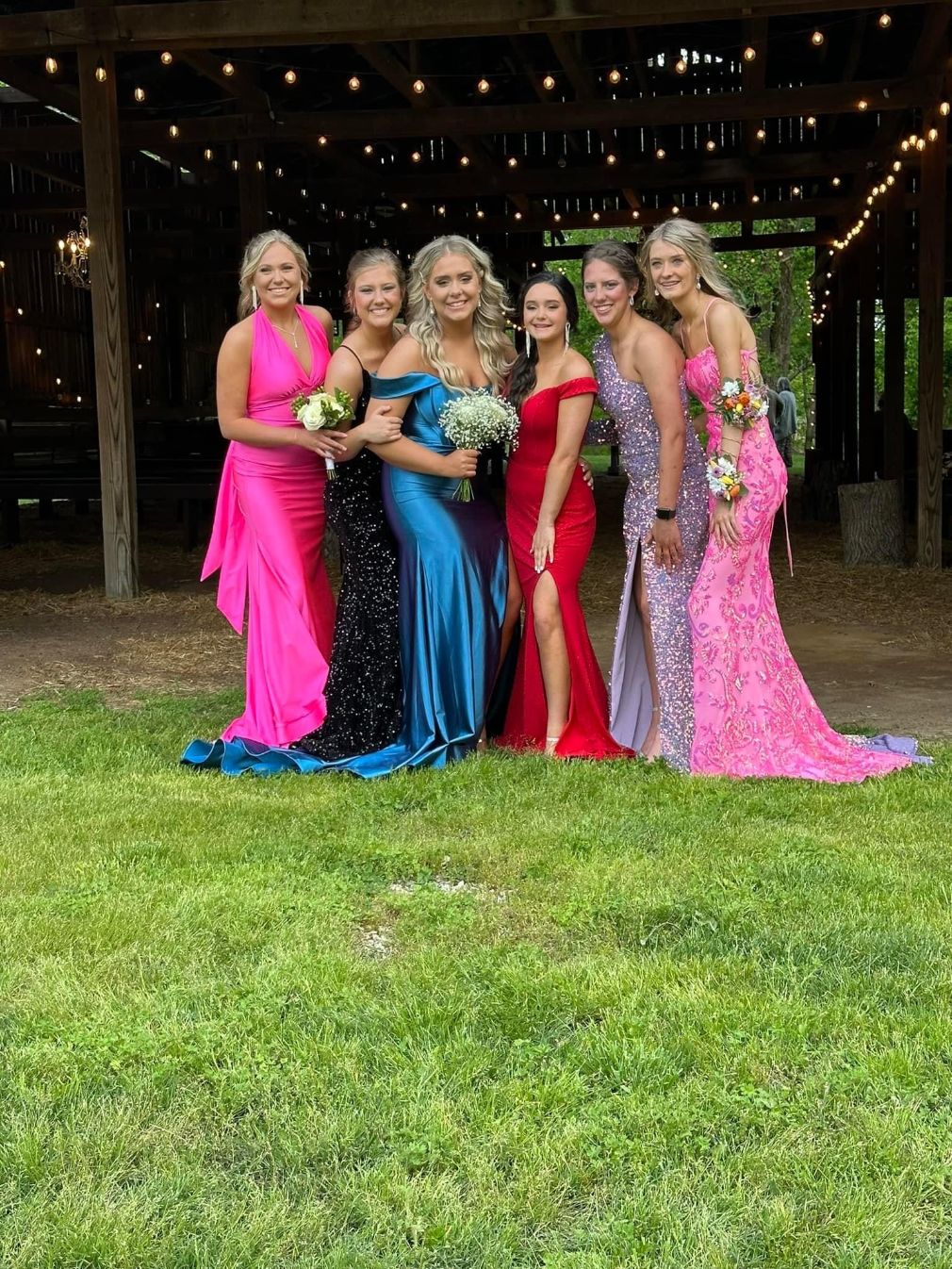 6 young women dressed for Prom on the grounds of Hayes House