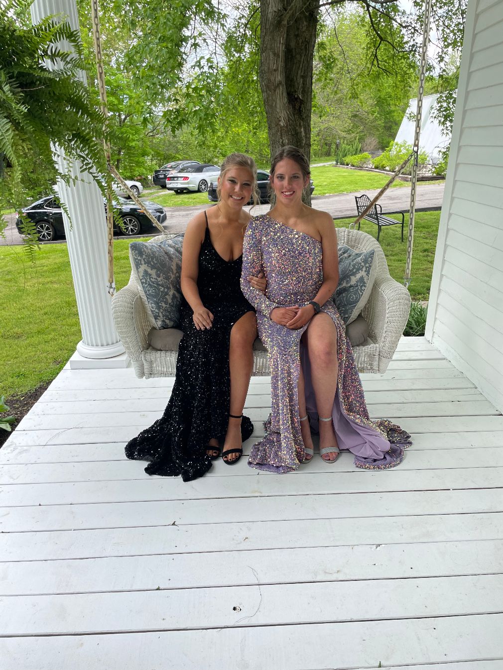 Dressed for Prom, 2 women on the porch swing at the Historic Hayes House<br />
